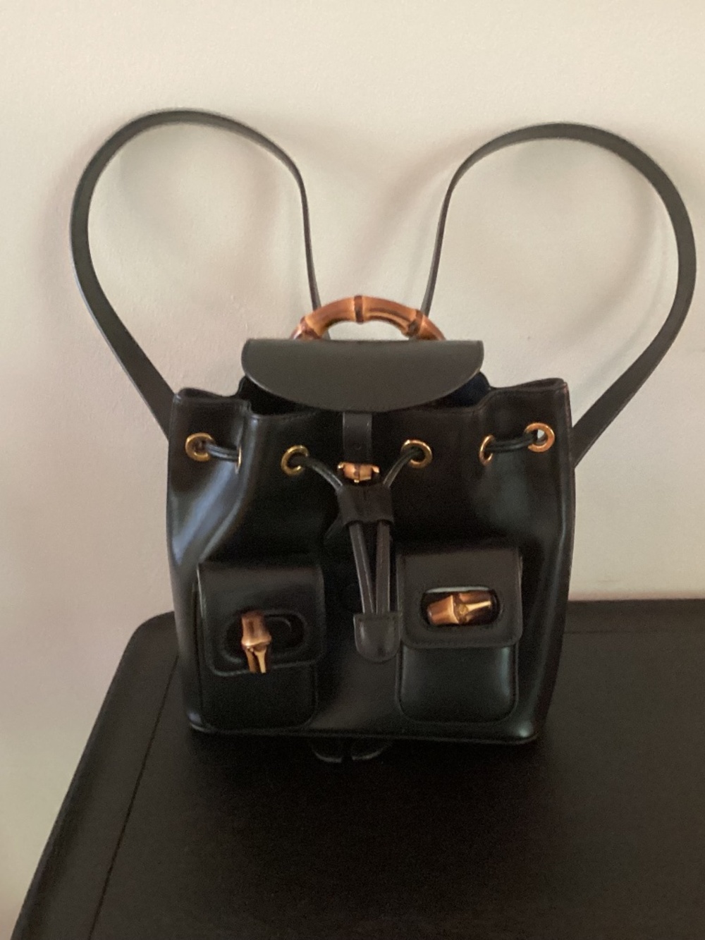 Gucci small backpack purse.